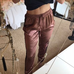 Silk joggers. Rose gold w/ black stripeNever worn